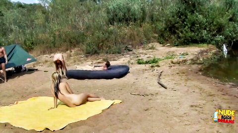 Nude blonde lesbians kissing on sunny nudist beach