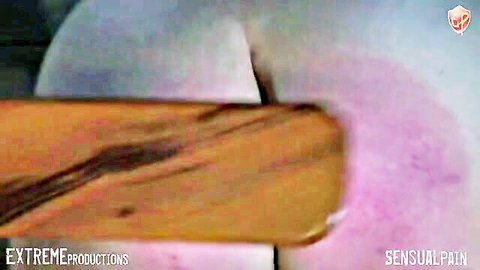Two women in sensual paddle spanking swap, bare skin and wooden paddle