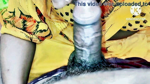 Big shiny erect cock protruding from yellow floral dress held by hand