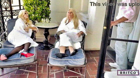 Busty blonde MILFs Brittany Andrews and Karen Fisher in robes lounging seductively
