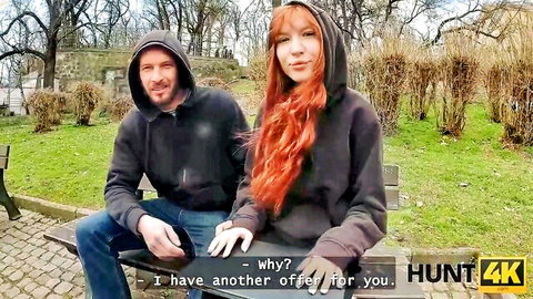 Redhead babe in hoodie flirts with hooded guy on park bench in public pickup tease