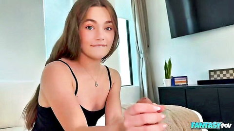 Young brunette teen in black tank top smiles while stroking hard cock POV