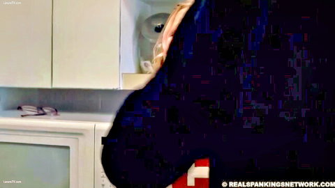 Woman bent over sink with pants down exposing red spanked bare ass for punishment