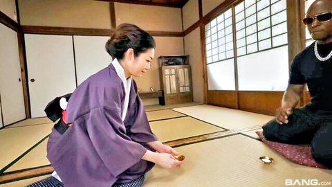 Naomi Togo in kimono kneels with black stud in JAV tease