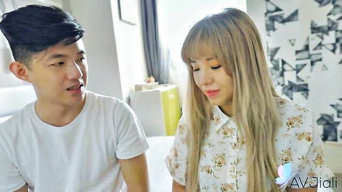 Lina S and her Asian beau intimately gazing at home in casual clothes