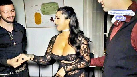 Yasmina Khan in revealing black lace lingerie smiling with two men
