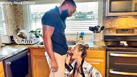 Mandy Rhea kneels for interracial blowjob with muscular black plumber