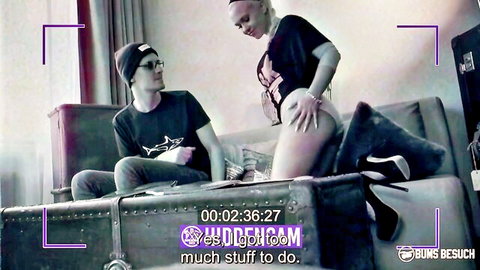 Blonde babe in tight black top and shorts grinds her ass on guys lap on couch