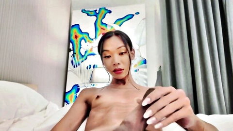 Oriental trans artist FEMBY solo playing with thick wang, topless on bed