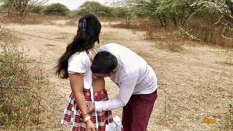 South Asian schoolgirl in plaid skirt gets lifted by guy outdoors in dry field tease