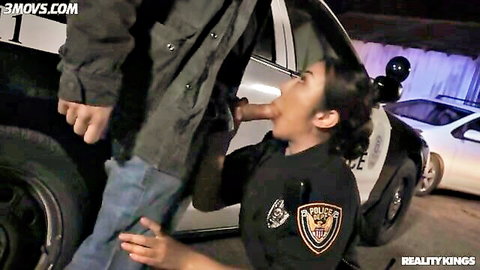 Nicole Doshi in police uniform sucking Mick Blue's cock outdoors
