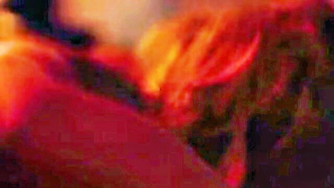 Blurry abstract fiery red and orange flames background with no visible action