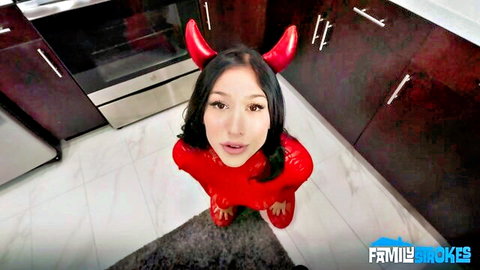 POV of sexy Asian teen in tight red devil costume with horns teasing daddy in kitchen