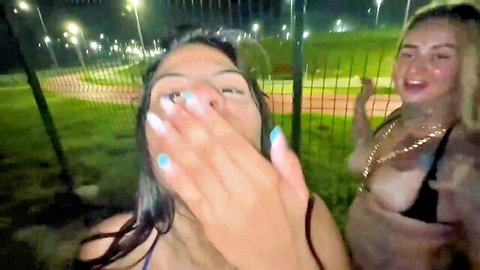 LunnaGeek and blonde friend in revealing bikinis outdoors at night