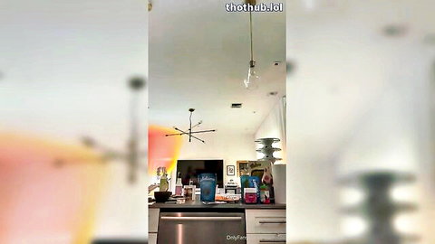 Mia Khalifa in kitchen teasing with drink, curvy Arab beauty