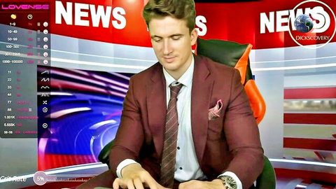 Handsome news anchor in maroon suit sits at Lovens Discovery News desk speaking professionally