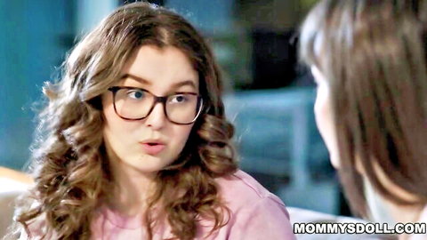 Surprised brunette teen in glasses faces curvy stepmom in intimate kitchen close-up