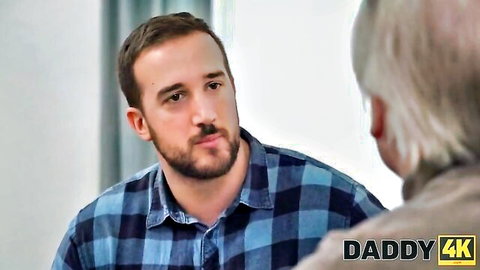 Megan Love in Daddy Issues: young bearded man in plaid shirt talks with older daddy