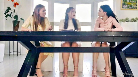 Three sexy women in dresses excitedly plan a lesbian wedding threesome