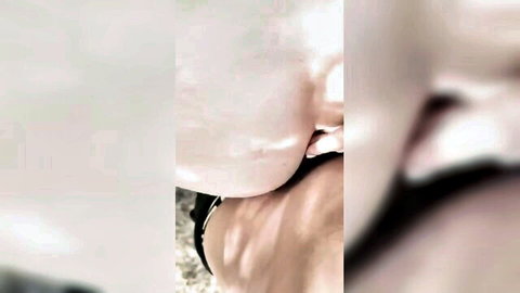 Blonde amateur with tongue out licking huge pale tits closeup