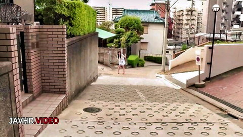 Ruka Mihoshi in white dress walking up urban Japanese path in JAV HD video