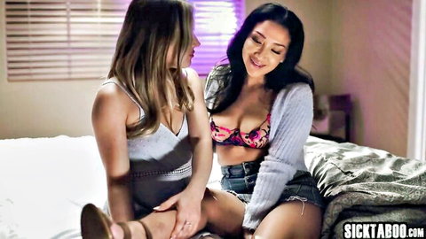 Hot brunette and blonde babes in bra and shorts teasing intimately on bed