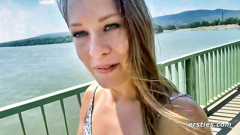 Blonde Blue from Budapest in sexy low-cut top by the lake