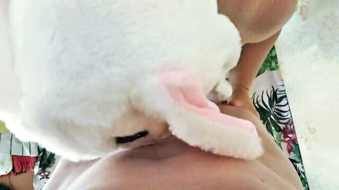 Amateur woman in bunny ears sucking hairy cock close-up