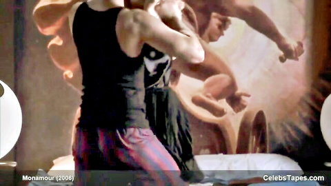 Muscular guy in tank top fucks woman in black dress doggy style on bed