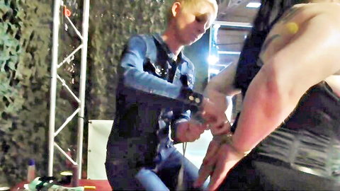 Blonde domme cuffs Cat's wrists in public BDSM breast pain challenge