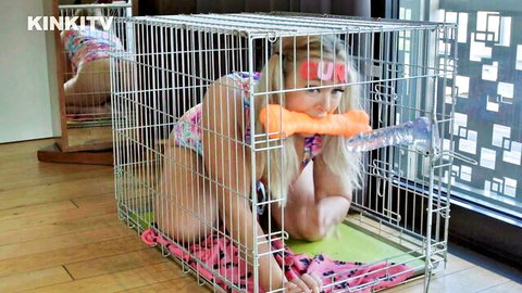 Blonde petgirl Beth caged in bikini with orange dildo gag