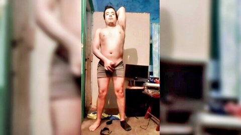 Shirtless Latino man posing with bulge in tight shorts, Jesus and Robert series