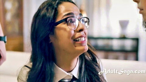 Mixed Asian schoolgirl with glasses surprised by peer pressure in uniform