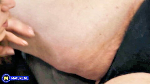 Mature Edina exposes big tits in steamy lesbian embrace with younger woman