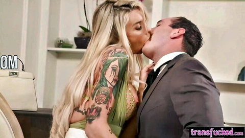 Big titted blonde TS with tattoos kissing lawyer in suit