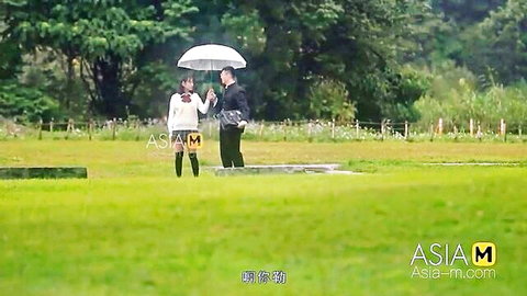 Chu Meng Shu in stockings holding umbrella with partner outdoors