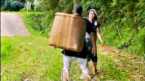 Japanese woman in white top chasing man with bamboo basket in rural path