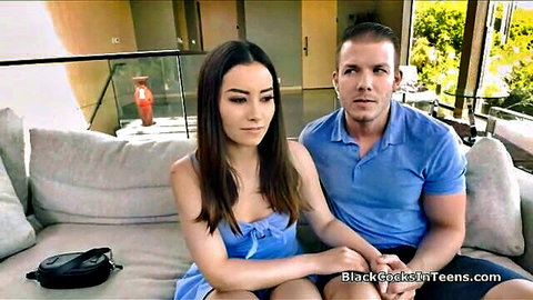 Aria Lee half Asian teen in blue dress with cuckold bf on couch