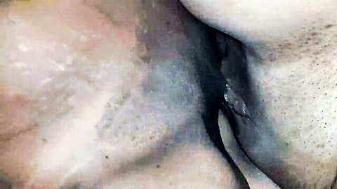 Close-up of two women tribbing, pussies rubbing intimately