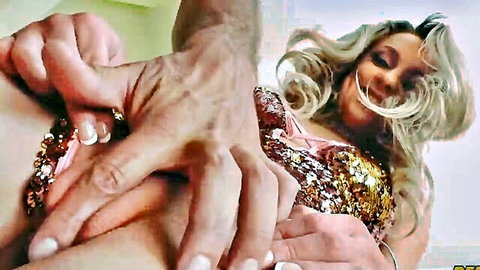 Man's strong hands groping blonde woman's huge exposed tits in sparkly gold top