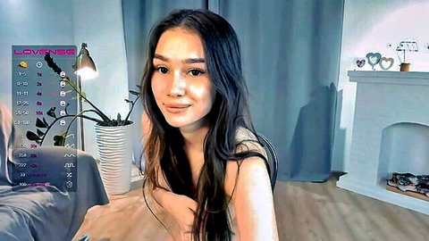 Juliepenningtona seductively shows her perky tits in solo webcam