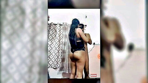 Indian woman in black thong lingerie poses ass up in bathroom mirror