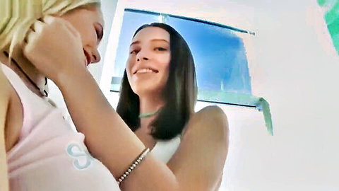 Lana Rhoades and Mia Malkova smiling intimately, blonde and brunette in tank tops