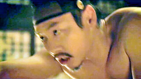 Shirtless Korean man with mustache in intense erotic movie scene