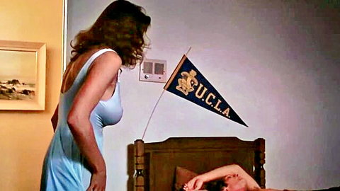 Brunette MILF in sheer blue dress seduces young guy on bed in UCLA dorm room