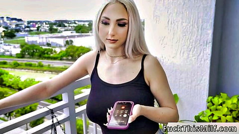 Skylar Vox blonde teen in tight black tank top showing big tits on balcony