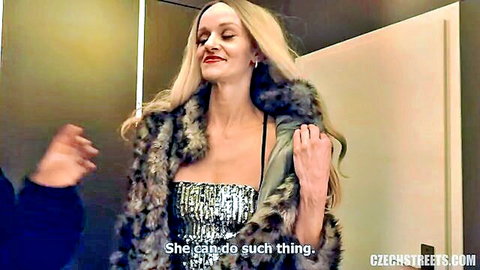 Blonde Czech woman in fur coat and sparkly dress smiling on street pickup
