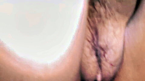 Close-up of Filipino teen's spread pussy lips exposing wet pink vagina and pubic hair