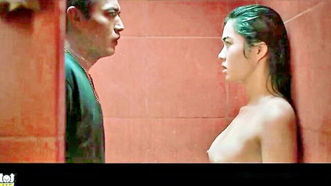 Topless Filipina teen with big wet tits pressed against shower wall as man stares