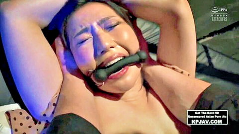 Japanese MILF bound and gagged with ball in mouth, tears streaming